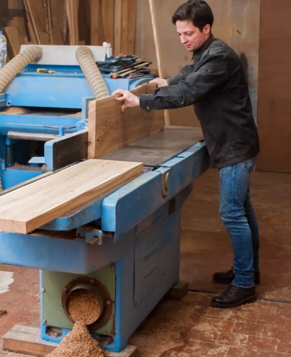 male-carpenter-planing-wood-on-a-lathe-in-a-carpen-2025-01-10-03-58-00-utc male-carpenter-planing-wood-on-a-lathe-in-a-carpen-2025-01-10-03-58-00-utc